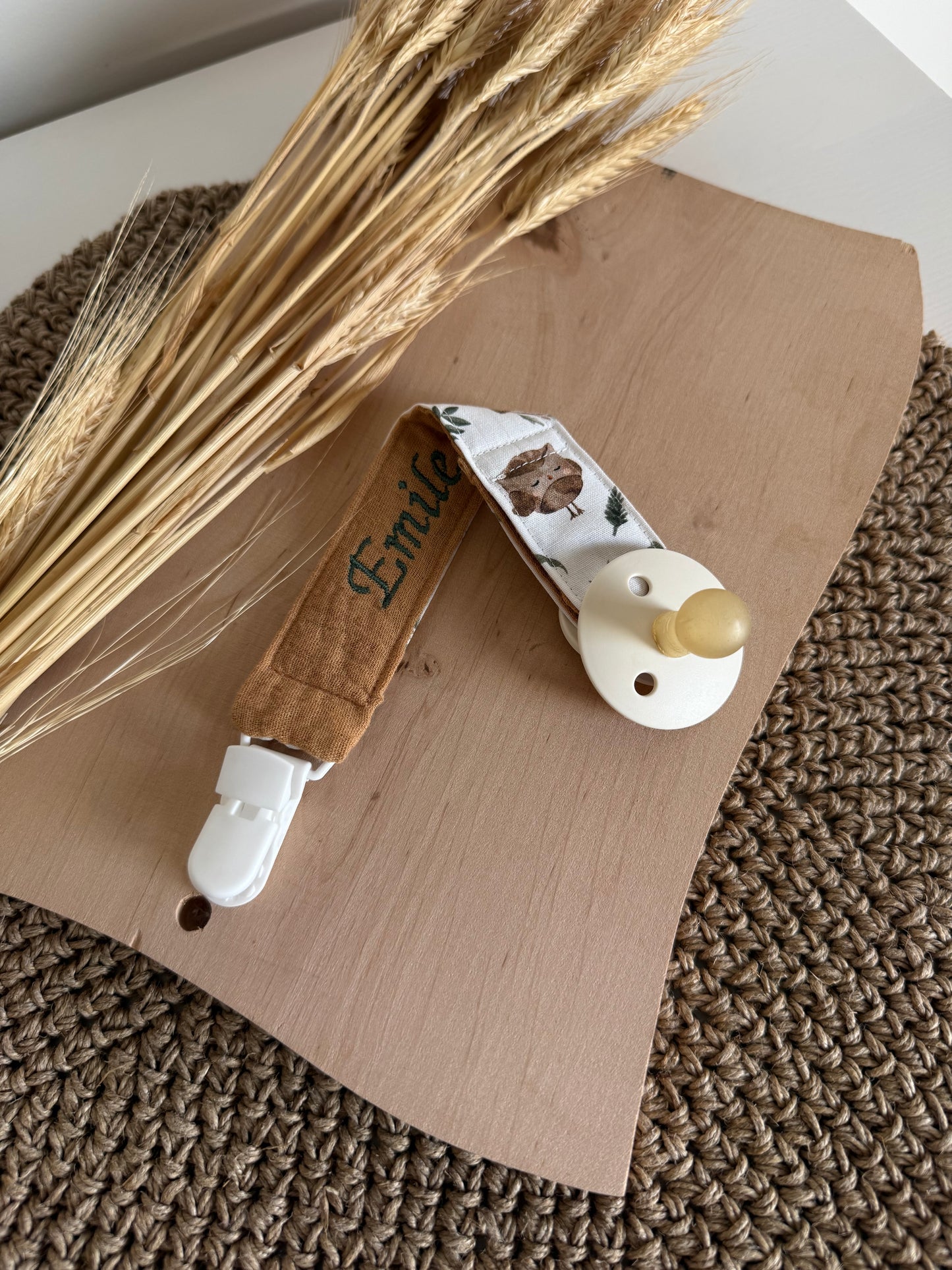 Attache tétine bi-tissu