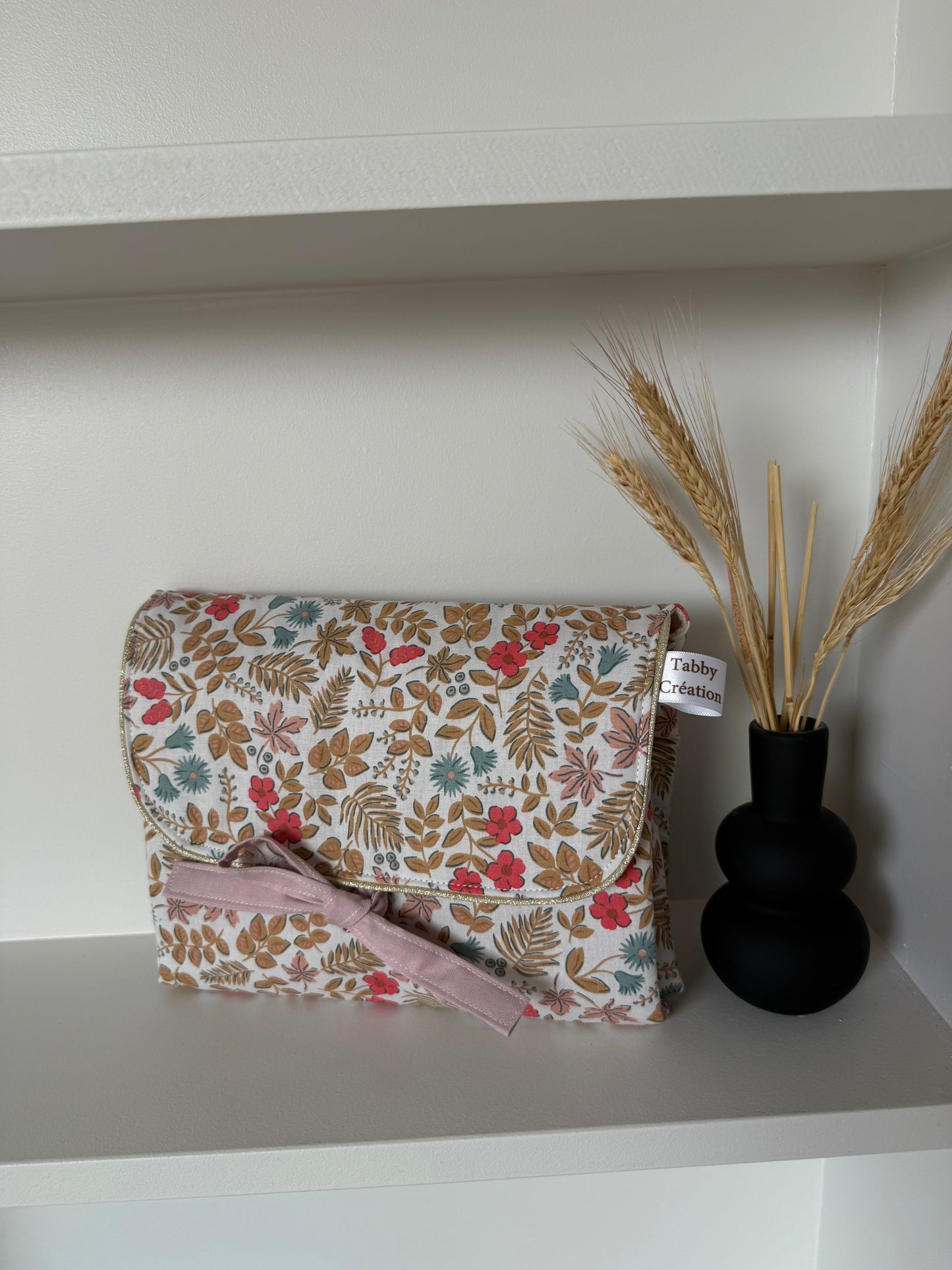 Pochette à langer nomade finition doré